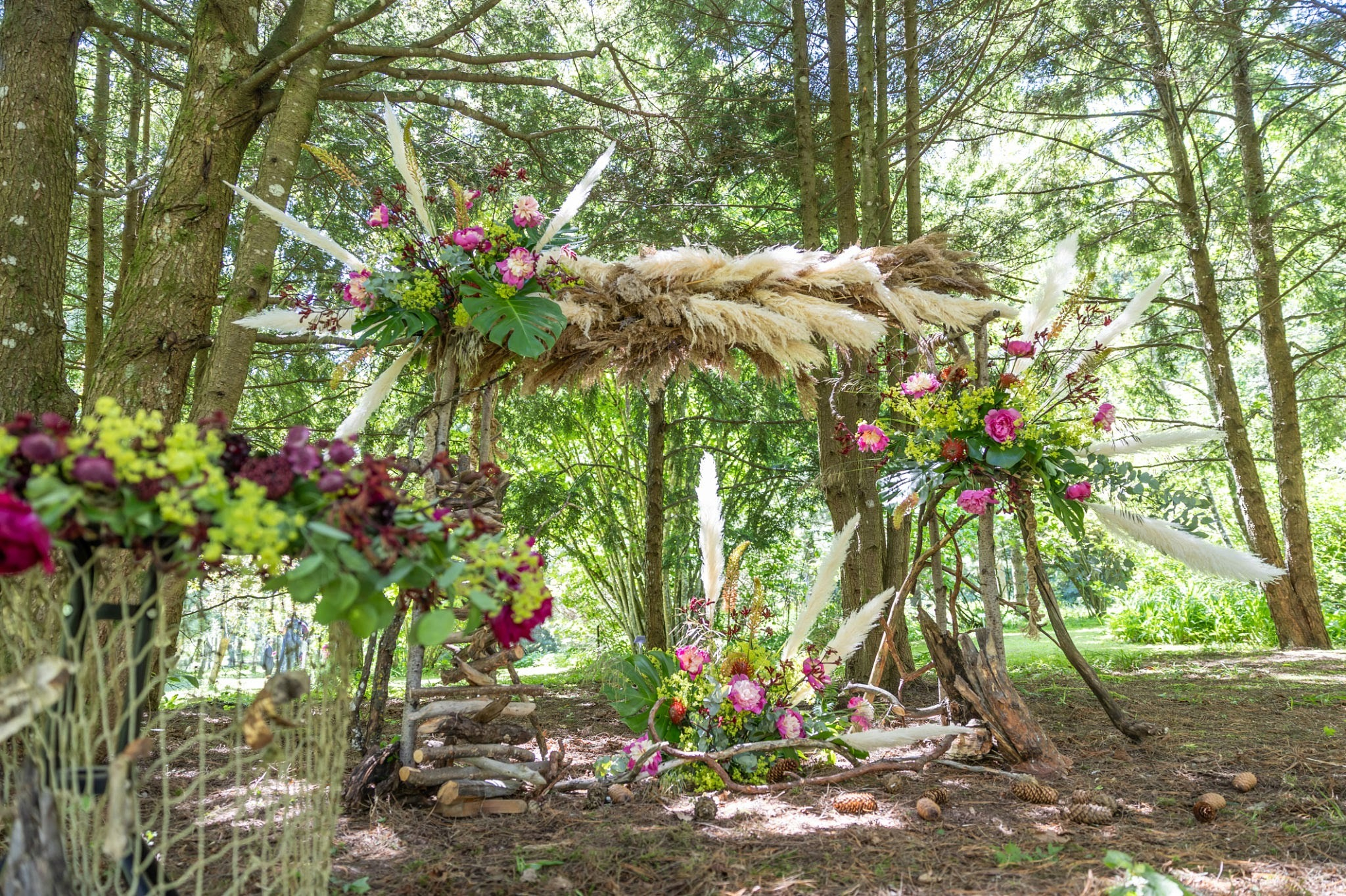 Natural materials like bamboo, living palms, and dried pampas create a timeless, low-impact mandap aesthetic., AI generated
