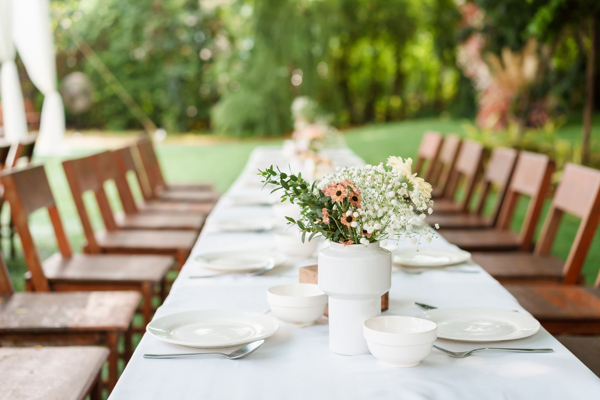 Artisanal stoneware, brass cutlery, and organic linen elevate wedding tablescapes without synthetic materials., AI generated